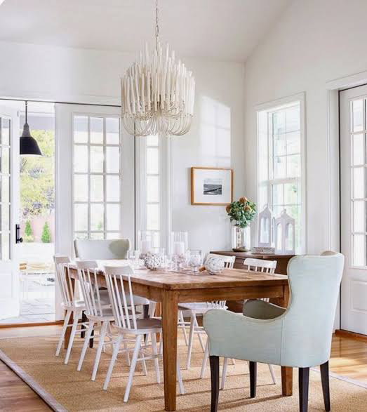 Coastal kitchen with woven rattan pendant over an island